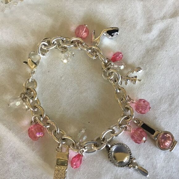 $12 ea of 3/$25. Silvertone “Girly” Charm Bracelet - Picture 2 of 7